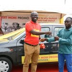 Mr.Jerry Boachie-Danquah (Left), Marketing Manager presenting the car key to the winner, Emmanuel Mais