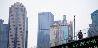 Asian shares step back, Microsoft’s brisk earnings boost tech optimism
